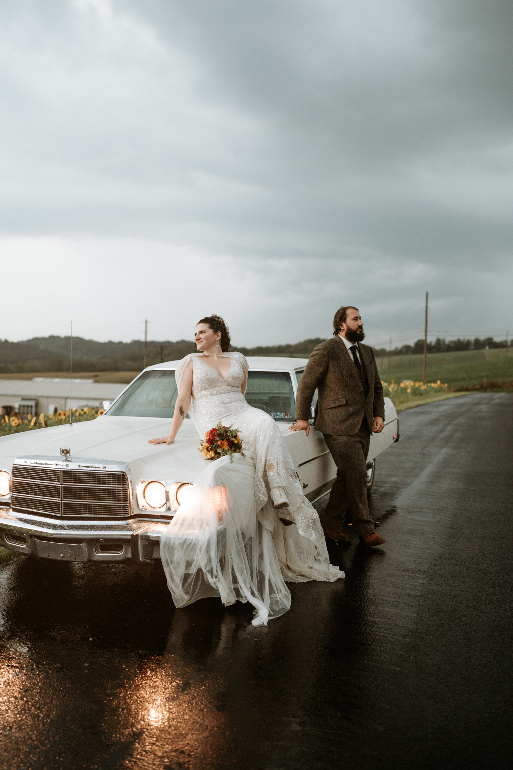 A rainy anniversary session with their vintage car